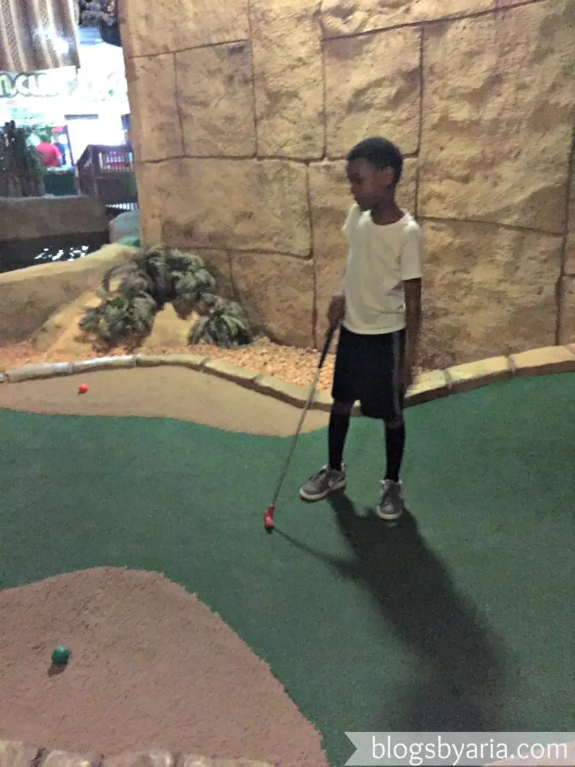 playing miniature golf