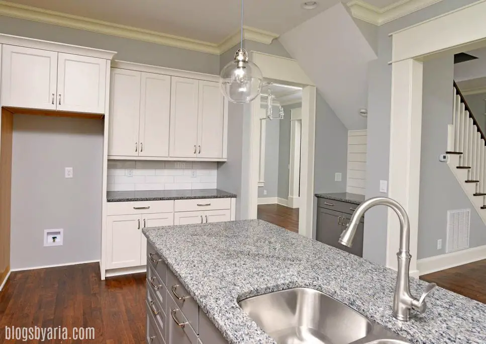 off white kitchen with gray painted island