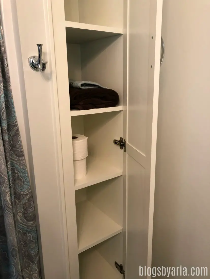 small linen closet in bathroom
