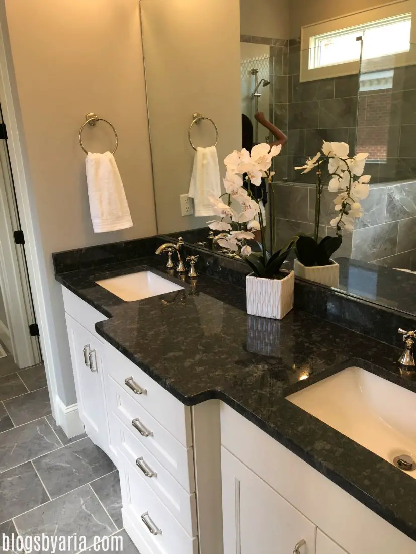 master bathroom with dark granite counters