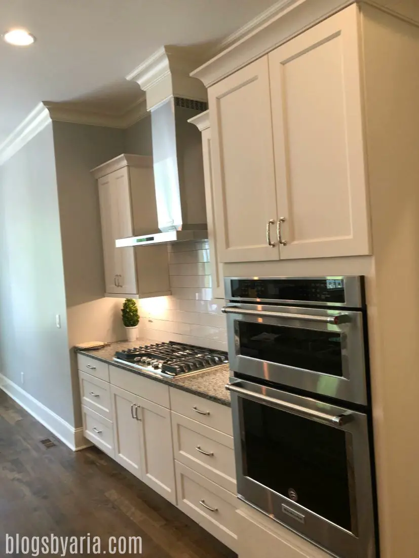 white kitchen with shaker style cabinets very clean look