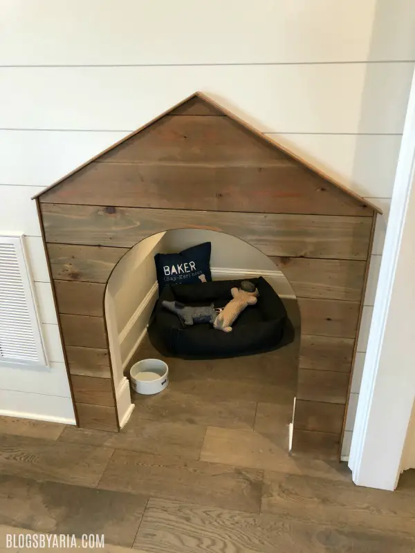built-in doghouse under stairs