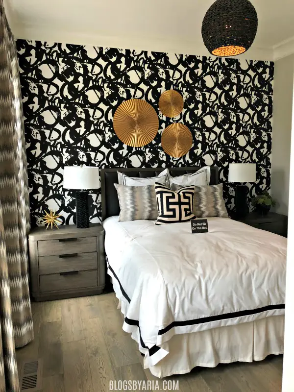fancy bedroom with wallpaper feature wall