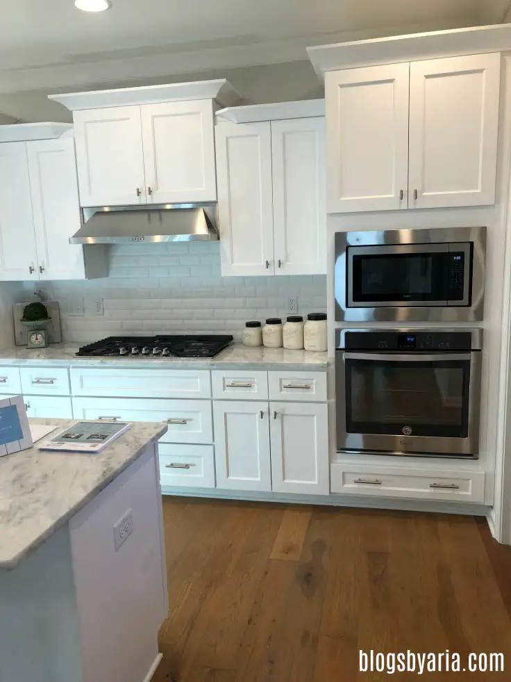 love this simple paneled cabinetry in this #whitekitchen