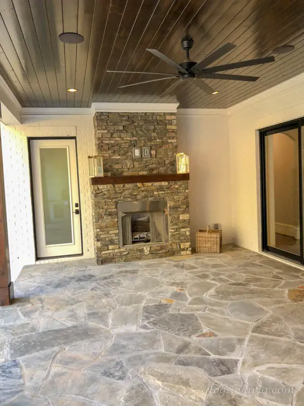 covered porch with fireplace and built in speakers