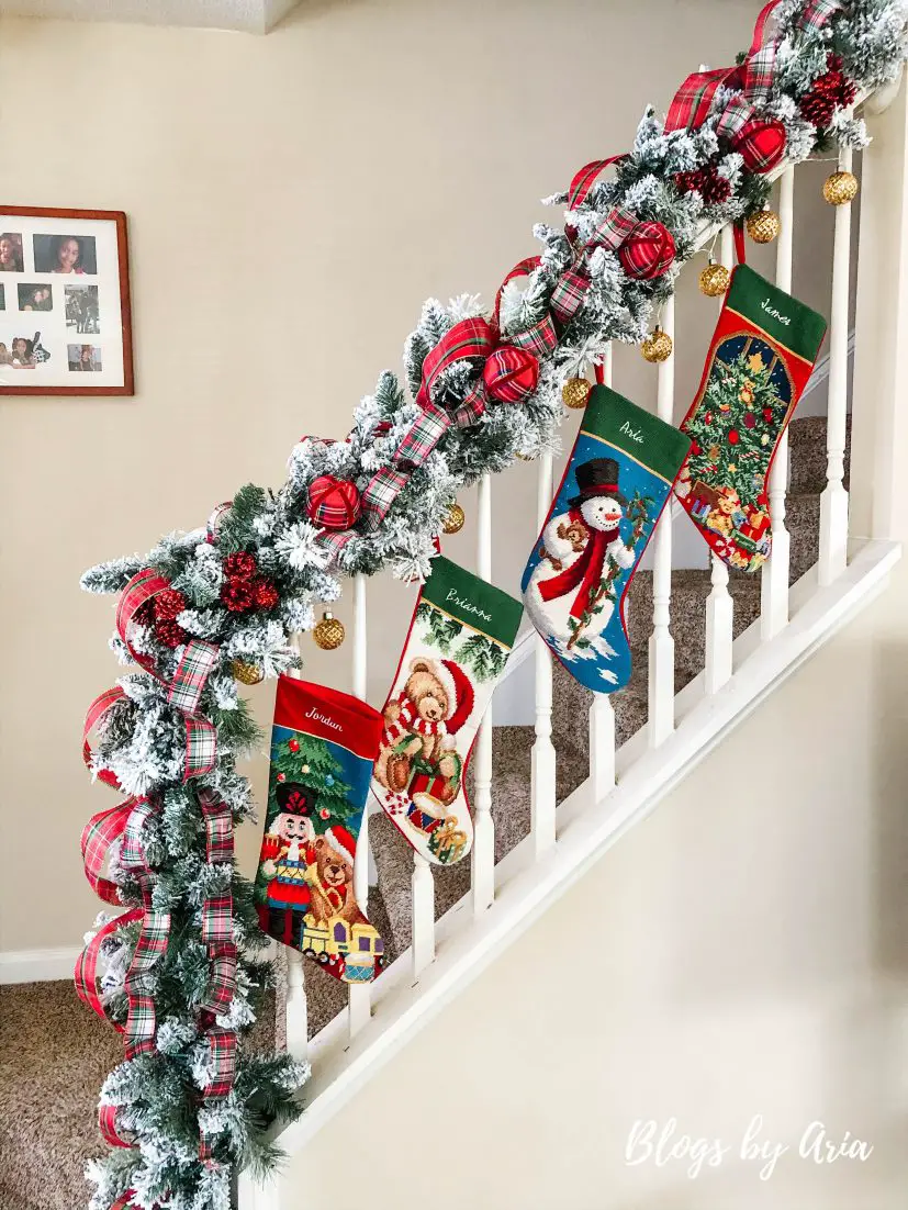 flocked stairway garland with stockings for Christmas