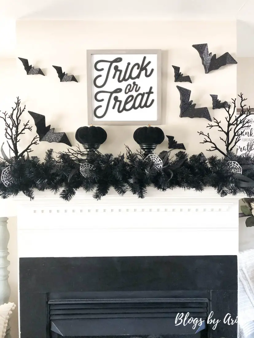 black and silver Halloween mantel