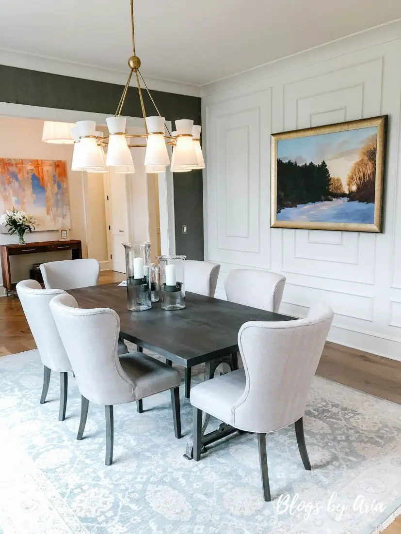 formal dining room featuring extensive custom millwork and trim
