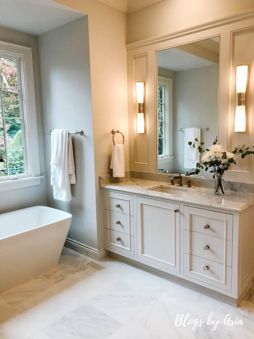 classic master bathroom with floor and wall marble tile