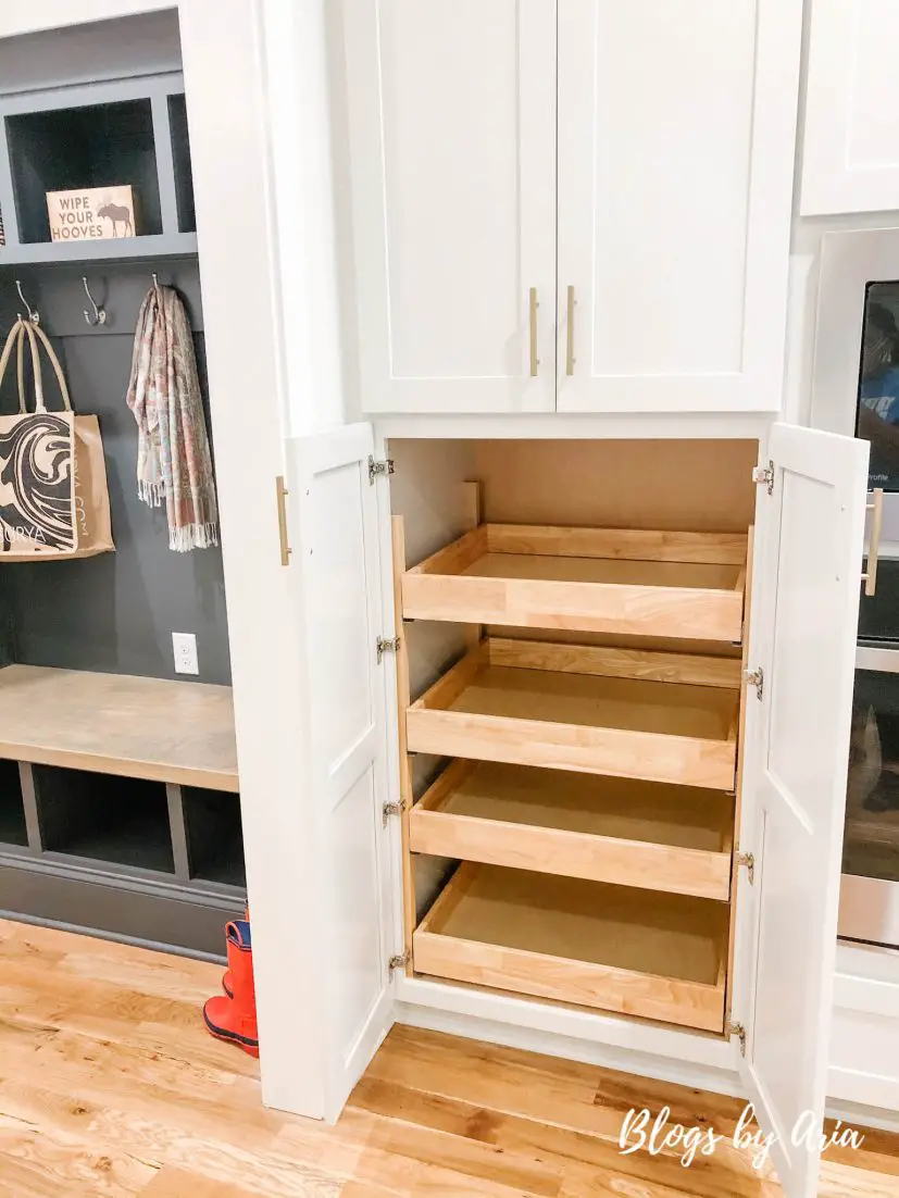 light gray kitchen with pull out drawers in pantry