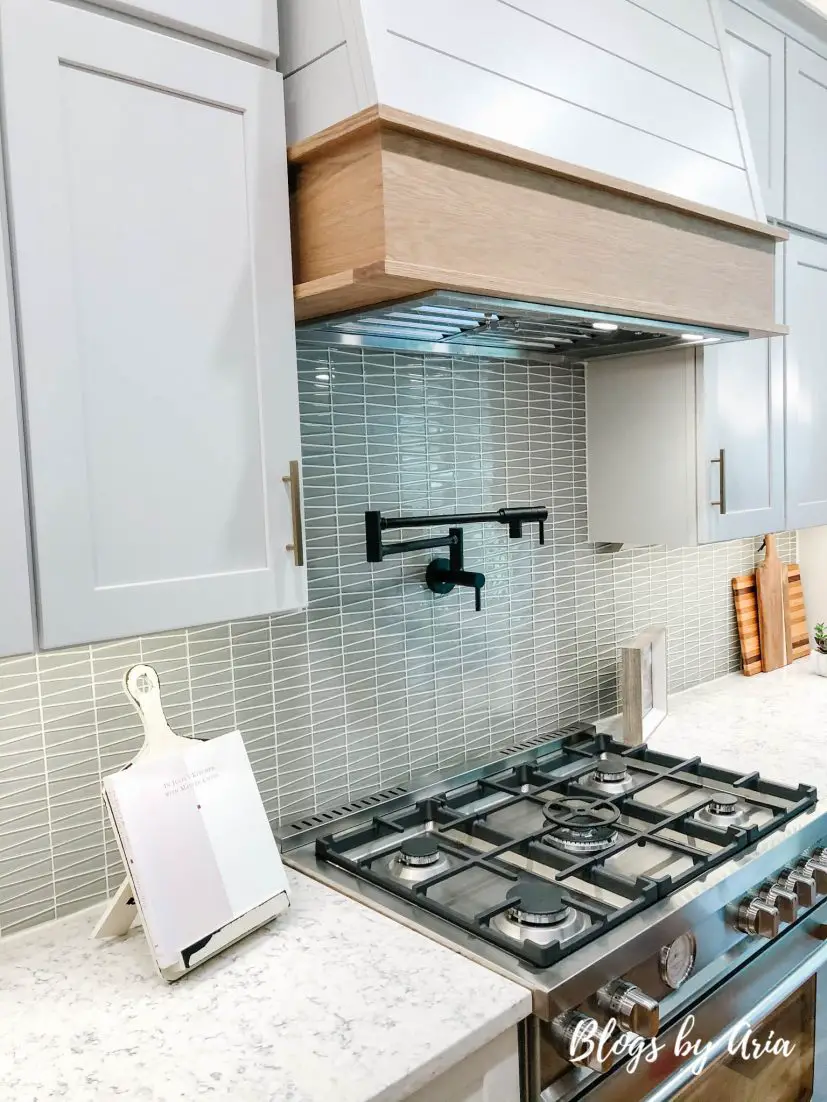 kitchen with shiplap wood trimmed hood