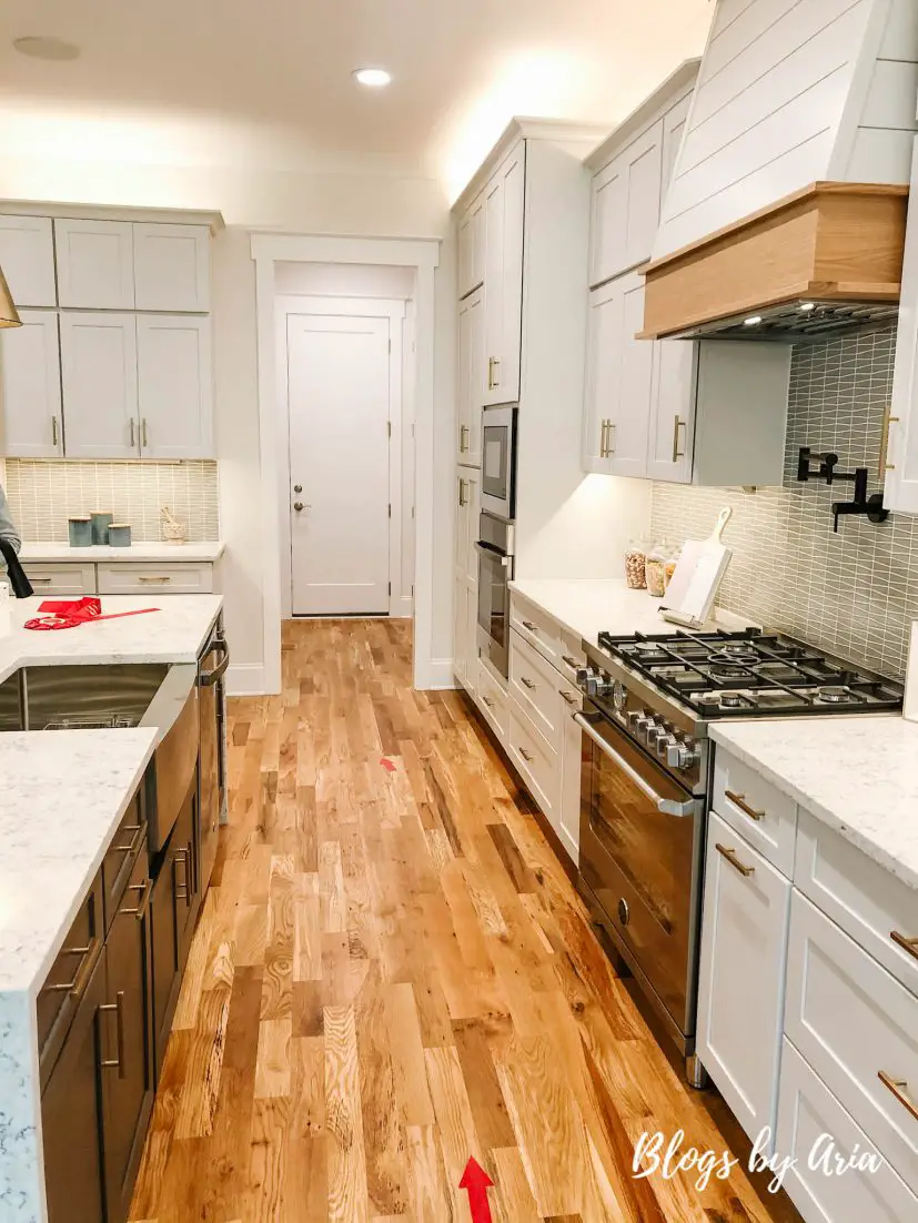 light gray kitchen with quartz countertops