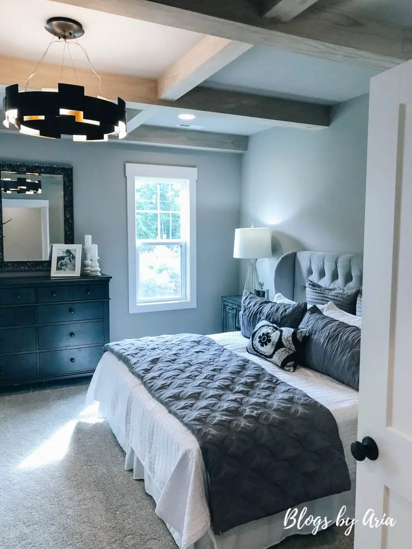 modern farmhouse bedroom with stained wood coffered ceilings