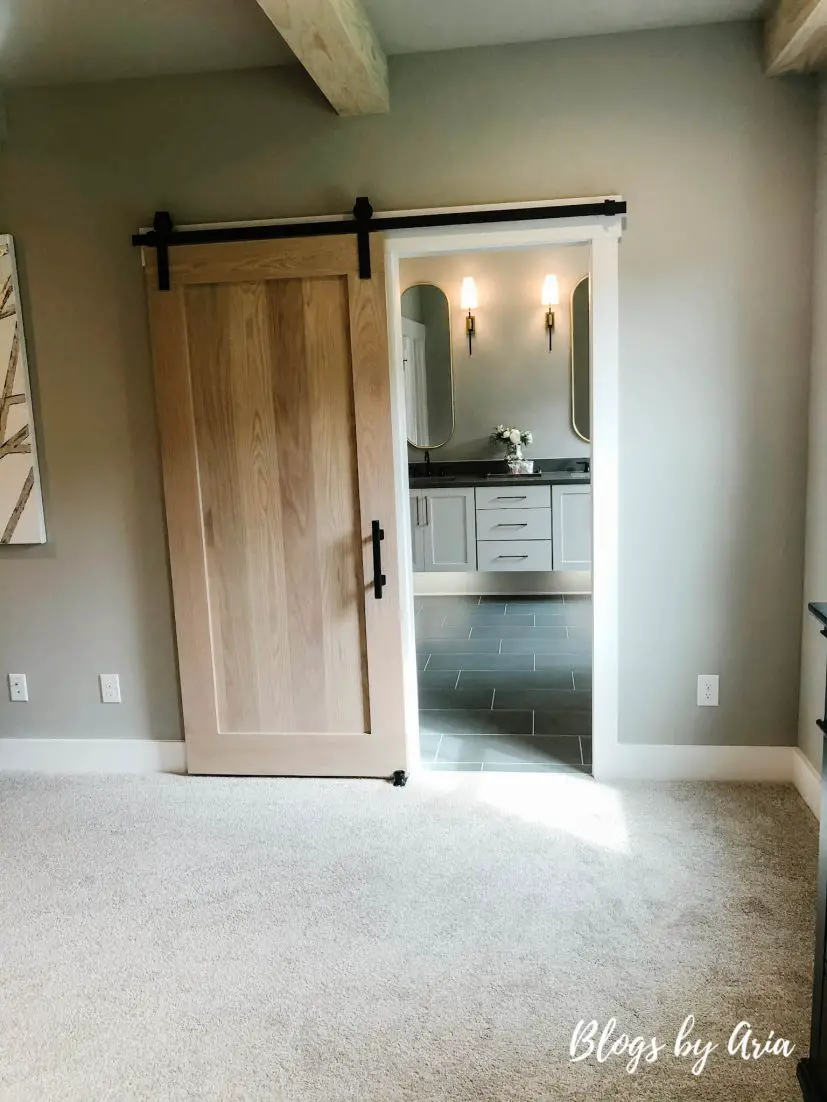 stained barn sliding door into bathroom