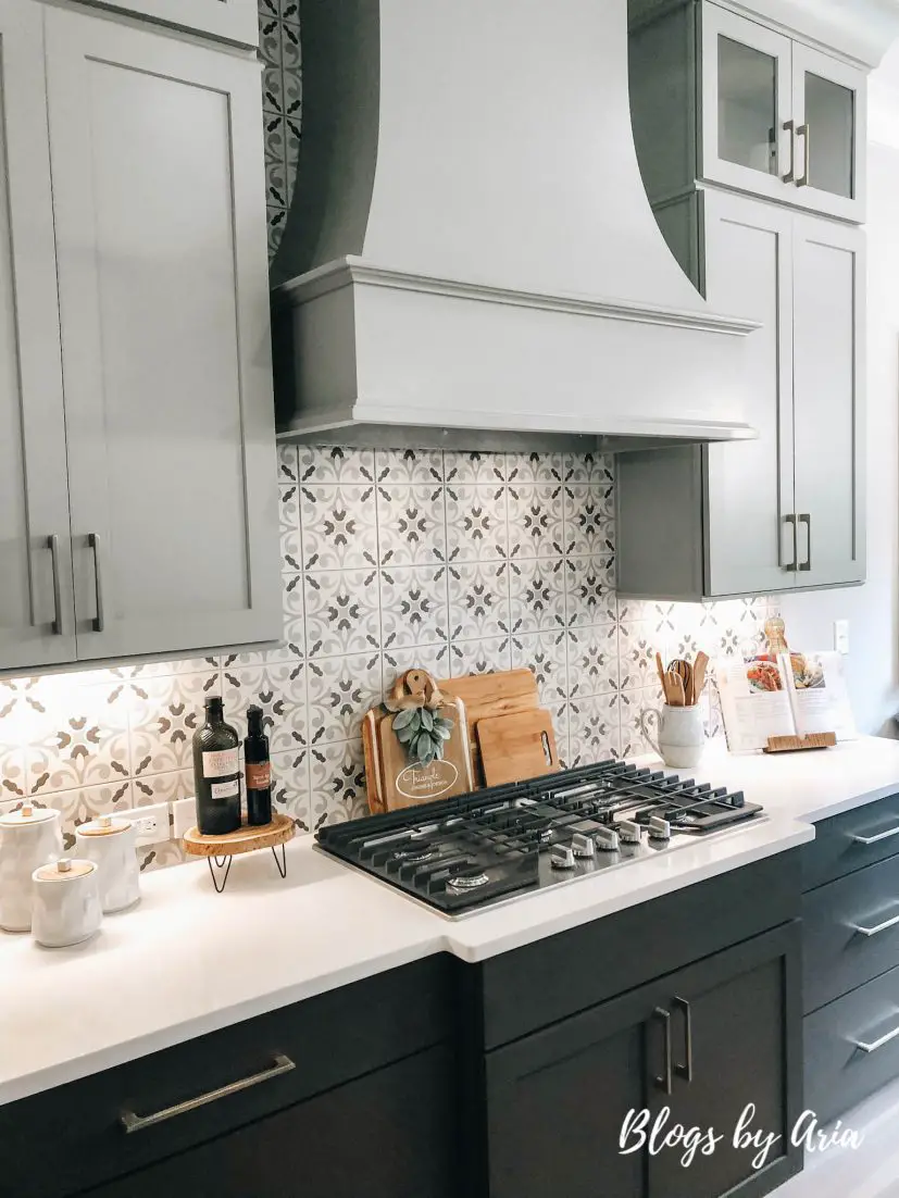 gray kitchen cabinets design patterned tile backsplash with black lower cabinets